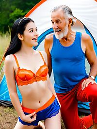 Older man in shorts excited as young woman in orange lingerie